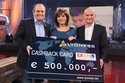 Lyoness CEO Hubert Freidl (right) presents the donation check to Birgit Schrowange and Wolfram Kons. Credit: RTL/Hempel. Lyoness CEO Hubert Freidl (right) presents the donation check to Birgit Schrowange and Wolfram Kons. Credit: RTL/Hempel.